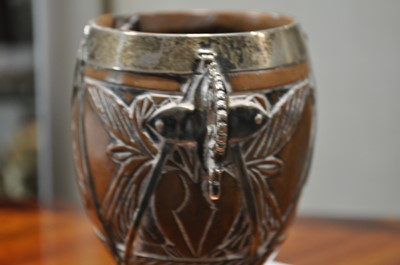 Lot 90 - A white metal mounted coconut cup of ovoid form, pricked date 1590