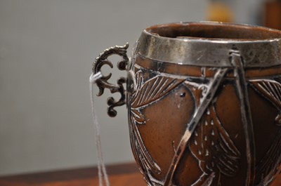 Lot 90 - A white metal mounted coconut cup of ovoid form, pricked date 1590