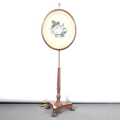 Lot 463 - A pole-screen, replaced oval panel with gros point needlework, Regency tripod base