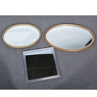 Lot 467 - A gilt painted oval wall mirror, bevelled...