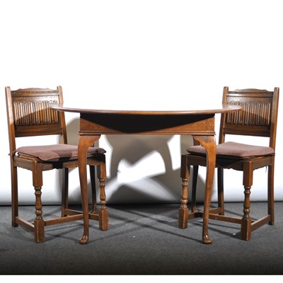Lot 449 - Reproduction oak dining suite, including dresser, table and four chairs