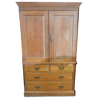 Lot 546 - An Edwardian stripped walnut linen press