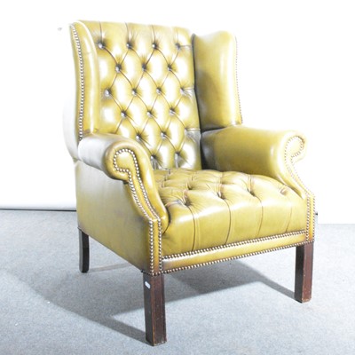 Lot 517 - A modern leather wingback chair in the Georgian style
