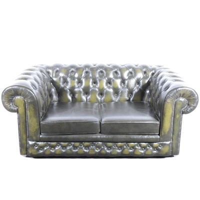 Lot 411 - A modern two-seater leather settee in the Chesterfield style