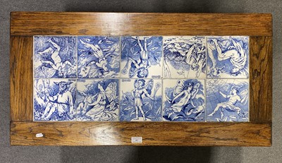 Lot 407 - An oak side table inset with eight Victorian 6" decorative tiles