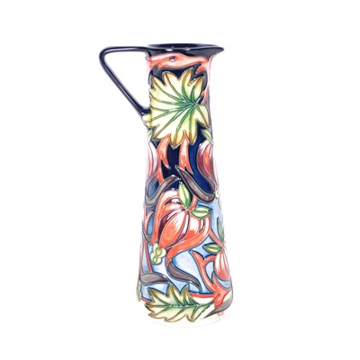 Lot 580 - A Moorcroft Pottery ewer, 'Red Ribbons' designed by Shirley Hayes for the MCC