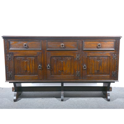 Lot 161 - A modern oak dining suite.