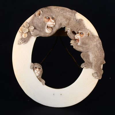 Lot 33 - A Japanese carved ivory oval photograph frame, early 20th Century