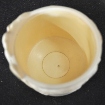 Lot 47 - A Japanese carved and stained ivory box, early 20th Century