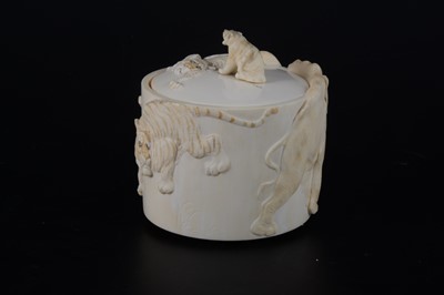 Lot 47 - A Japanese carved and stained ivory box, early 20th Century