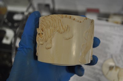 Lot 47 - A Japanese carved and stained ivory box, early 20th Century