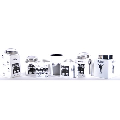 Lot 39 - A collection of reproduction Beatles Ware in  black and white, two teapots, storage jars etc.