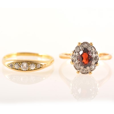 Lot 230 - Two yellow metal gemset rings.