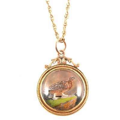 Lot 276 - A game bird pendant and chain