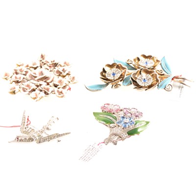Lot 308 - Trifari - two floral fur clips and a bird in flight brooch, an unmarked dress clip.