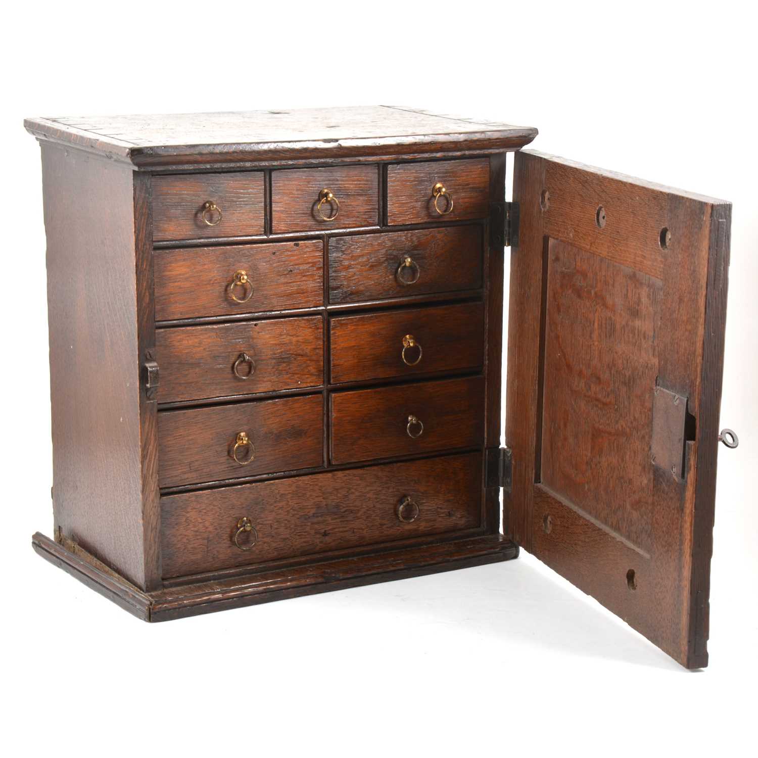 Lot 446 - George III oak spice cabinet