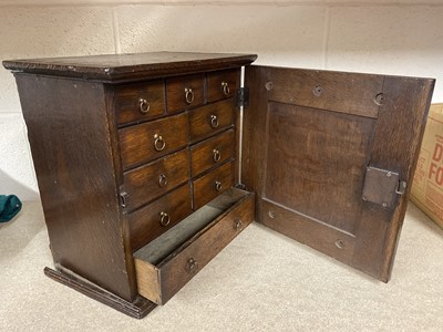 Lot 446 - George III oak spice cabinet