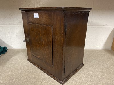Lot 446 - George III oak spice cabinet