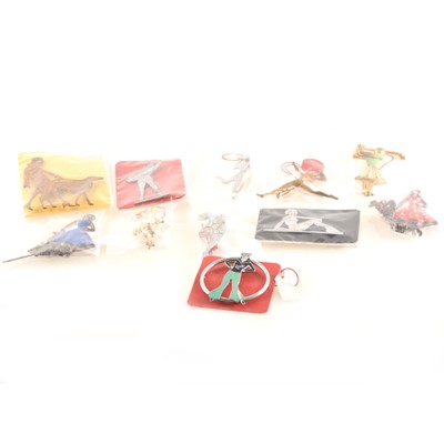 Lot 314 - Eleven Art Deco and 1950's pins and brooches, dancing and sports girls.