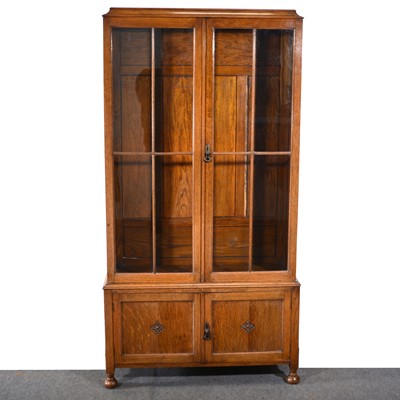Lot 487 - An oak glazed bookcase