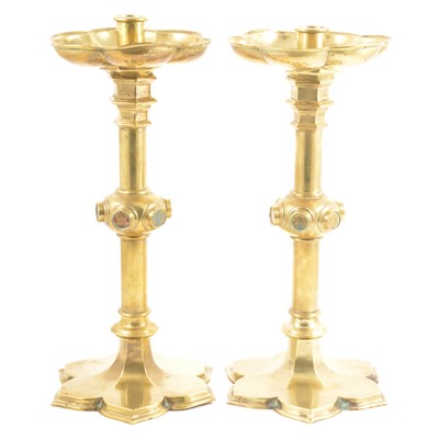 Lot 34 - A pair of Victorian Gothic Revival brass altar candlesticks, probably to a design by A.W.N. Pugin