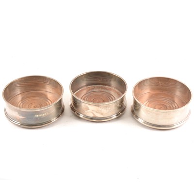Lot 184 - A pair of silver coasters, and another similar