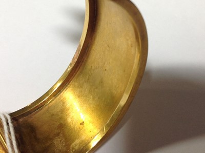 Lot 212 - A Victorian yellow metal half hinged bangle set with pearls.