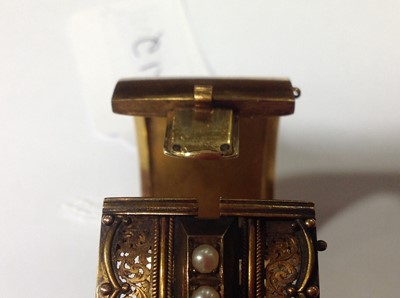 Lot 212 - A Victorian yellow metal half hinged bangle set with pearls.