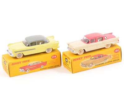 Lot 97 - Two Dinky Toys; no.180 Packard Clipper Sedan, two-tone cerise and beige body, no.174 Hudson Hornet Sedan