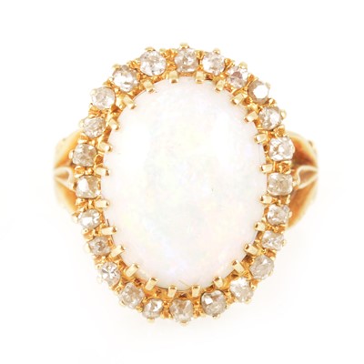 Lot 204 - An opal and diamond oval cluster ring.