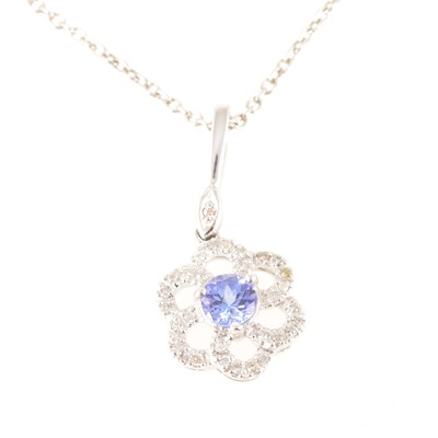 Lot 220 - A tanzanite and diamond pendant and chain