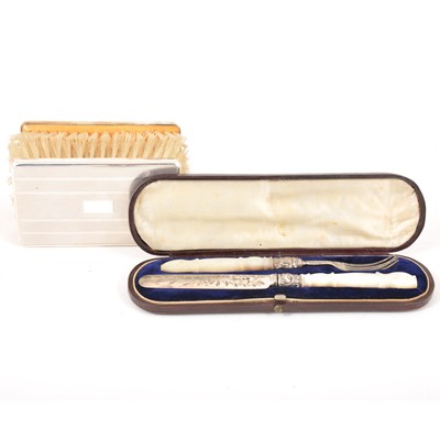 Lot 92 - A silver and mother of pearl knife and fork, George Unite, Birmingham 1852, and a pair of gentleman's silver-backed hairbrushes.