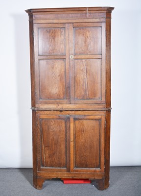 Lot 601 - Georgian oak freestanding corner cupboard