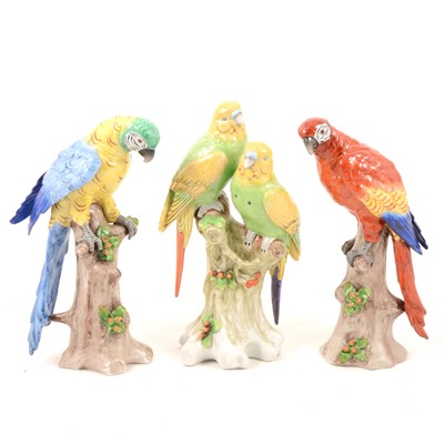 Lot 93 - Pair of Sitzendorf porcelain parrots, and a group of parakeets.