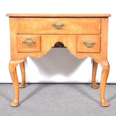 Lot 460 - George II style walnut lowboy