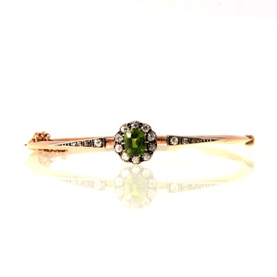 Lot 77 - A Victorian demantoid garnet and diamond bangle.