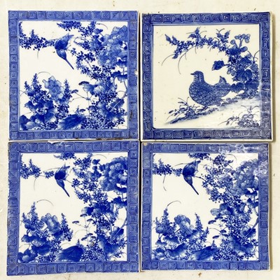 Lot 82 - Four Chinese blue and white tiles.