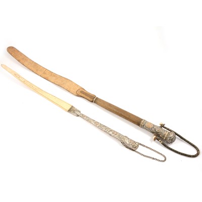 Lot 119 - Two North African camel whips