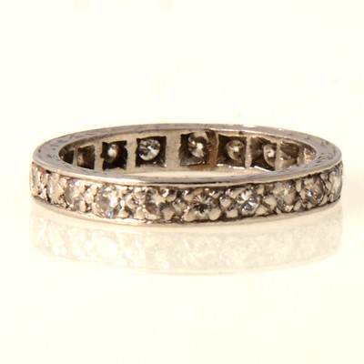 Lot 67 - A diamond full eternity ring.