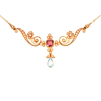 Lot 97 - An Edwardian necklace set with pink tourmaline and aquamarine and seed pearls.