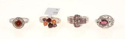 Lot 393 - Gemporia - Three garnet and white zircon rings, plus a rhodolite garnet ring.