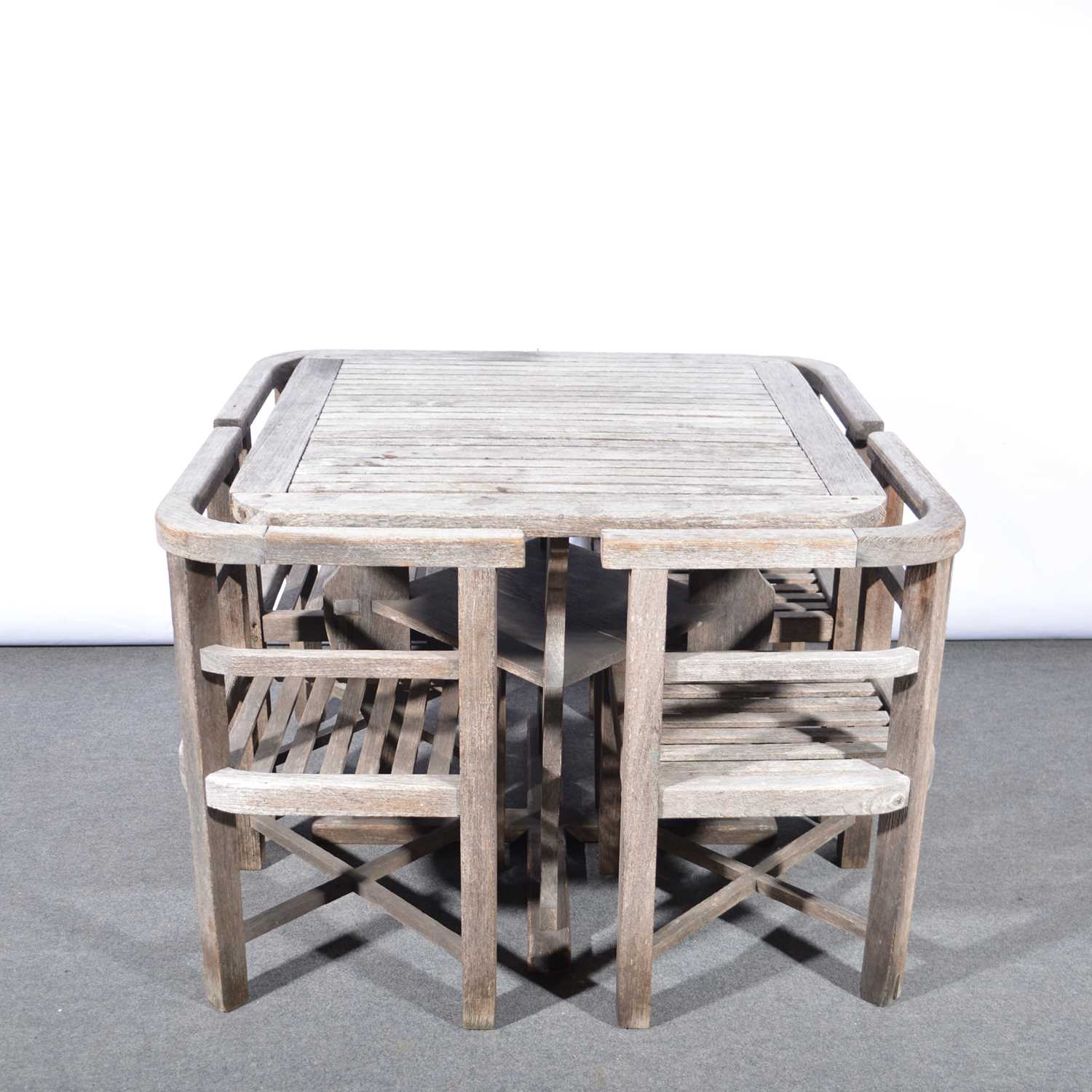 Lot 1029 - 'Collingwood' teak garden table and four chairs, retailed by Heals