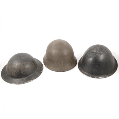 Lot 136 - Three military tin helmets