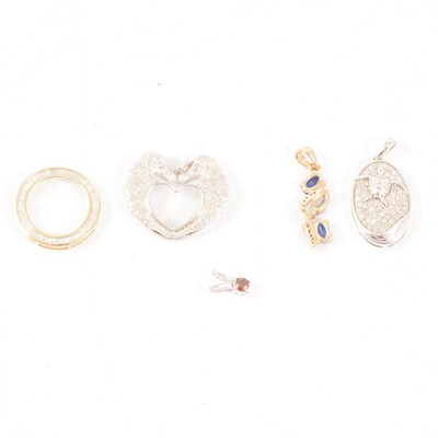 Lot 333 - Gemporia - Six diamond set pendants in 9 carat yellow gold and silver.