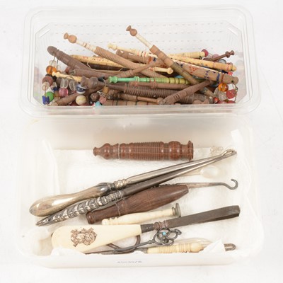 Lot 220 - Bone and wooden pillow lace bobbins, button hooks for boots and gloves, treen needle cases.