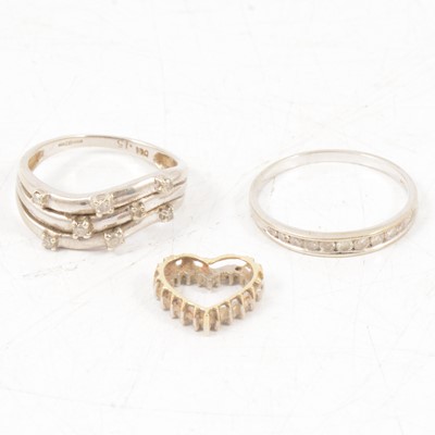 Lot 294 - Two diamond rings and a diamond heart pendant.