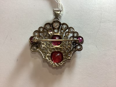 Lot 87 - An Edwardian style ruby, red spinel and diamond brooch/pendant.