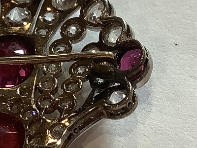 Lot 87 - An Edwardian style ruby, red spinel and diamond brooch/pendant.