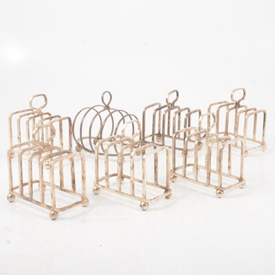 Lot 197 - Silver toast rack and six silver plated toast racks