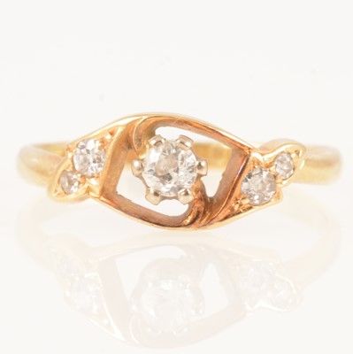 Lot 285 - A diamond old cut ring with two stones in each shoulder.